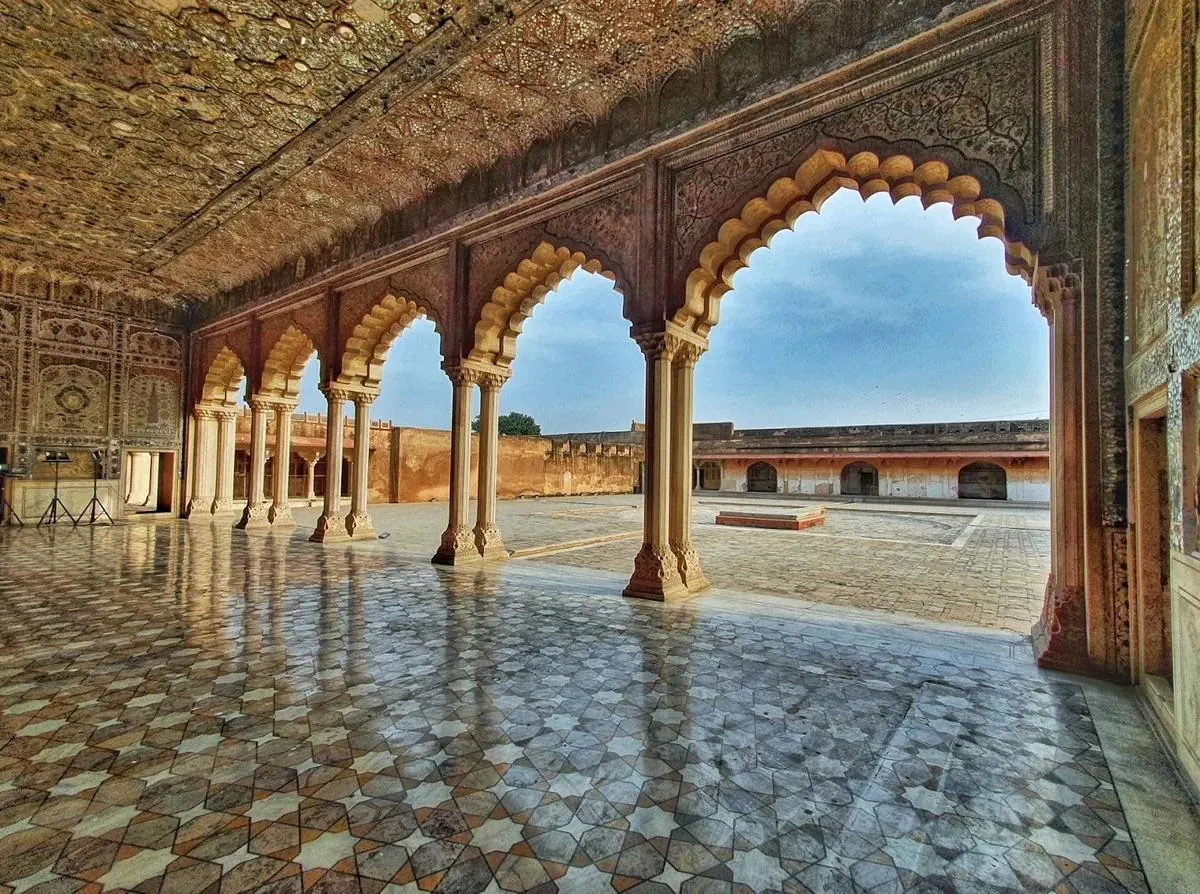 Mughal arches and a marble floor in a royal pavilion