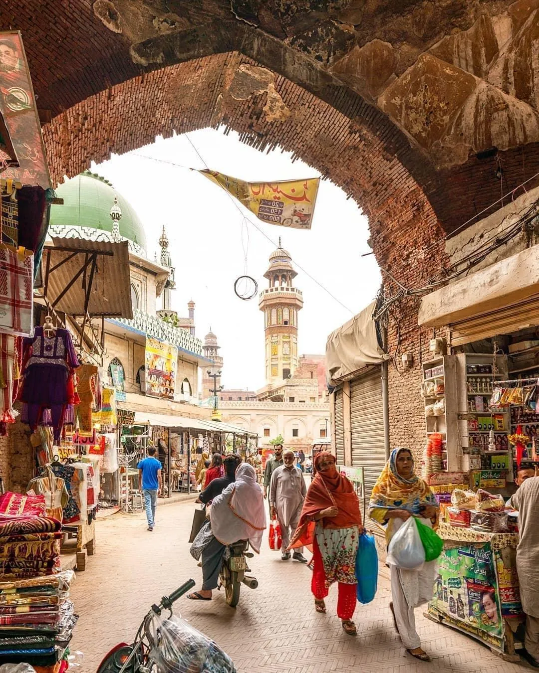A bazaar seen through an old gateway in Lahore's Walled City